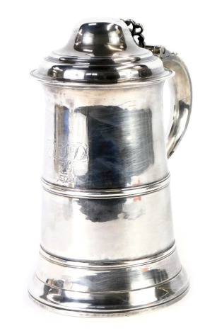 A George IV silver tankard, with pierced thumb piece and moulded top, on a banded body bearing the initials AJD and inscribed 1829, maker Samuel Godbehere, Edward Wigan & James Boult, London 1826, 22.90oz.