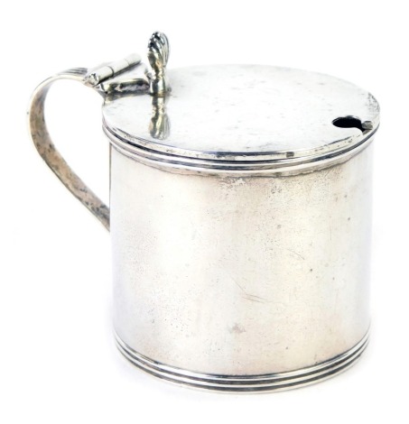 A George VI silver 'drum' mustard pot, with shell capped thumb piece, of plain design with blue glass liner, maker Mappin and Webb, Birmingham 1937, 2.82oz. (the liner AF)