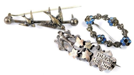 Two bar brooches, comprising a Victorian Forget me Not swallow brooch, 4.5cm diameter, a white metal two swallow brooch, 5cm wide, unmarked, and a white metal and paste stone floral oval brooch, 4cm wide, 15.4g all in. (AF) (3)