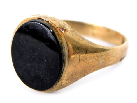 A 9ct gold signet ring, with oval black bloodstone, in a rose gold setting, size P, 2.9g all in.