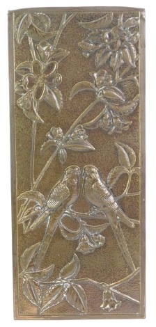 A Mid Century brass picture, embossed with a pair of budgerigars in a tree with blossom, 35.5cm x 15cm.