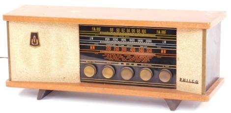 A Philco tabletop vintage radio, in teak case with glittered and panelled sides, 26cm high, 56cm wide, 19cm deep.