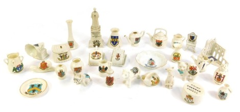 Carlton and other crested china, to include a statute in Memory of Edith Cavell, Arms of the City of Liverpool, part of the ruins of Whitby Abbey, Arms of Whitby, lion, fishing creel, bulldog, and a Prime Cheddar Cheese, Arms of Canterbury. (a quantity)