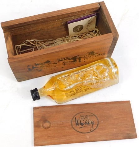 A bottle of Edinburgh Rock Whisky, 10cl, in wooden presentation case.