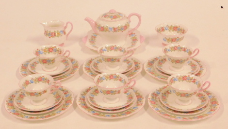 A Shelley Porcelain part tea service, decorated with a band of flowers, pink highlighted, comprising bread plate, teapot, cream jug and sugar bowl, six teacups, saucers, tea and salad plates.