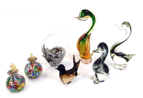 Art Glass, comprising two Murano cane decanters and stoppers, and various Murano animals, to include elephant, duck and three swans, the largest 24cm high.