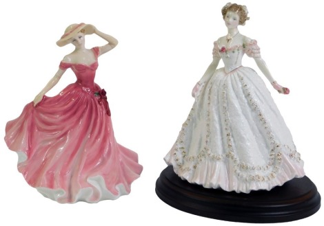 A Royal Doulton Lady of the Year 1997 figure HN3992, 20cm high, and Royal Worcester Sweetest Valentine figure, limited edition 5975/12500, on wooden plinth, 23cm high. (2)