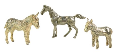 Three silver plated animals, comprising two donkeys and a horse, the horse 8cm high, the donkeys 7cm and 5cm high. (3)