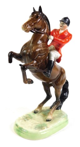 A Beswick figure of a huntsman, on rearing horse, number 868, 24cm high.