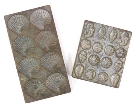 Two metal chocolate moulds, to include praline shells, flowers and fish, 13cm x 11cm and 19.5cm x 10cm respectively. (2)