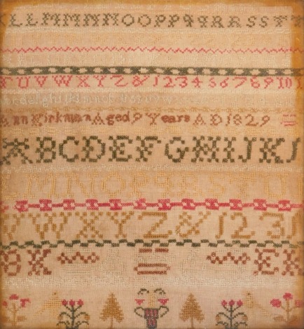 A George IV sampler, for the alphabet, by Anne Kirkman aged nine 1829, 29.5cm x 27cm, framed. (AF)