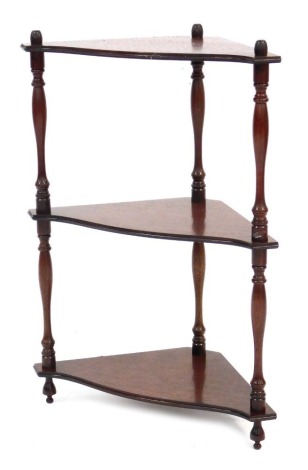 A reproduction mahogany three tier whatnot, 60cm high, 42cm wide, 24cm deep.