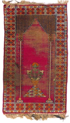 An Eastern prayer rug, with central Mihrab within multiple borders, 162cm x 92cm. (AF)