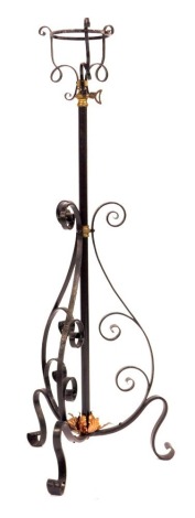 A 19thC adjustable cast iron oil lamp stand, painted in black with a copper rose base, 121cm high.