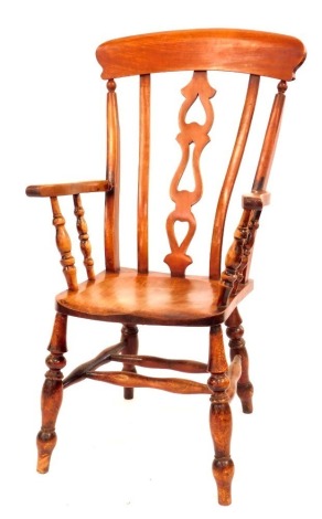 A stained beech lath back chair, with an arched cresting rail and pierced splat, with turned legs, 119cm high.