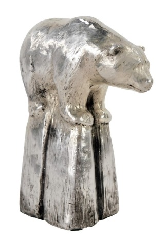 An Elizabeth II silver filled figure of a polar bear, modelled perched on a block of ice, Sheffield 1997, 6.43oz all in, 9cm high.