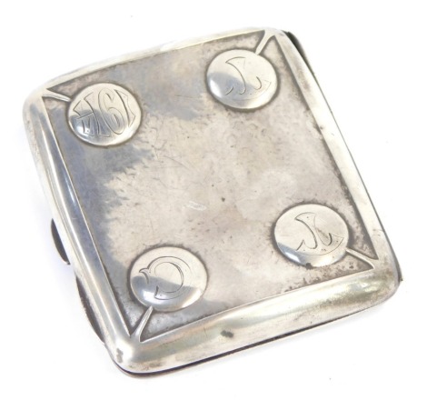 A silver cigarette case, of square section, the front with four embossed buttons, initial and date engraved 1914, hallmarks indistinct 2.61oz.