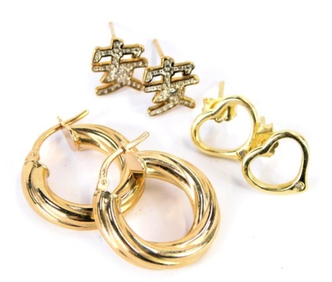 A pair of hoop earrings, stamped 375, pair of 9ct gold Chinese character stud earrings, 2.9g, and a pair of heart shaped earrings, stamped 925.