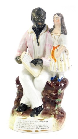 A mid 19thC Staffordshire pottery figure group, modelled as Uncle Tom and Eva, 18cm high.