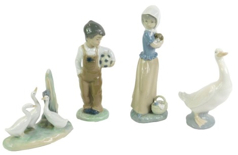 Four Nao porcelain figures, comprising a girl with a puppy, boy with a football, a duck, and three ducklings.