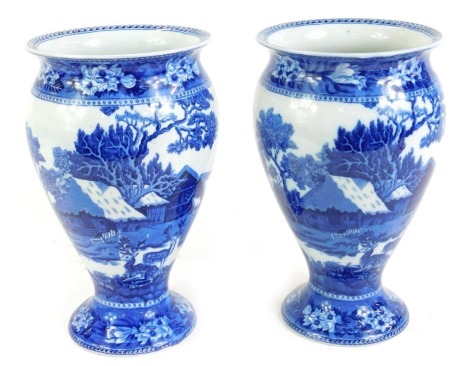 A pair of Wedgwood pottery blue and white Fallow Deer pattern vases, of baluster form, printed marks, 24cm high.