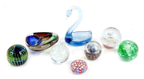 A group of glass paperweights, including Mdina glass dish modelled as a swan, and a Murano tricolour three division dish. (a quantity)