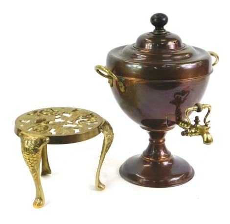 A brass circular kettle stand, raised on cabriole legs, together with a copper and brass twin handled tea urn, 36cm high. (2)