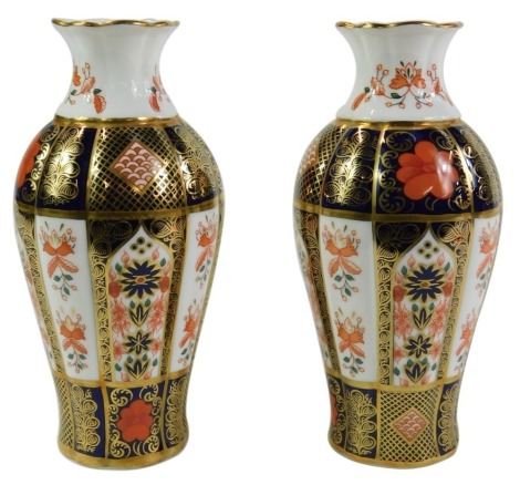 A pair of Royal Crown Derby Old Imari pattern vases, of fluted baluster form, 18cm high.