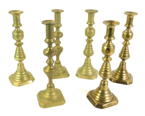 Three pairs 19thC brass candlesticks, 30cm high.