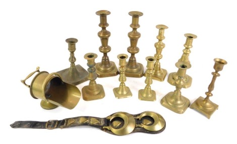 Assorted 19thC brass candlesticks, singles and pairs, together with a brass cigar scuttle and horse brasses. (a quantity)