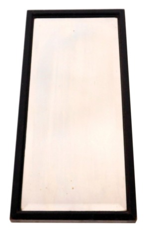 A Victorian ebonised wall mirror, inset bevelled glass, 47cm x 25cm.