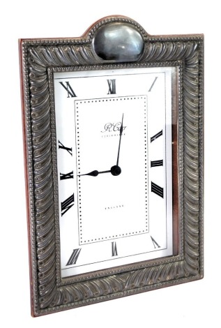 An Elizabeth II silver framed mantel clock, by R Carr, rectangular dial bearing Roman numerals, battery operated quartz movement, in a silver framed wooden case, Sheffield 1997, 19.5cm x 13.5cm.