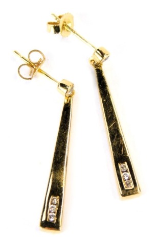 A pair of 18ct gold and diamond three stone drop earrings, cased, 3.8g.