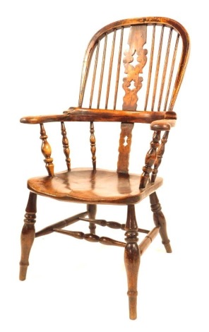 A 19thC elm and ash Windsor chair, with Christmas tree splat, scrolling arms and shaped seat, on turned stretchers and legs.