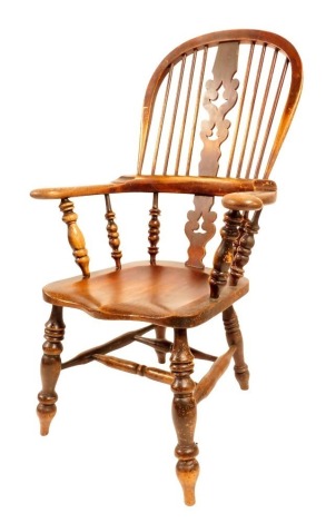 A 19thC elm and ash Windsor chair, with Christmas tree splat, scrolling arms and shaped seat, on turned stretchers and legs.