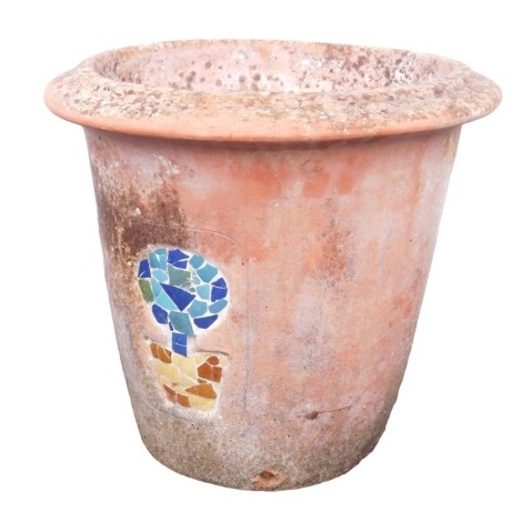 A terracotta garden pot, of cylindrical tapering form with out swept rim, decorated to the front with a mosaic pattern depicting a tree in planter, 53cm high, 56cm diameter.