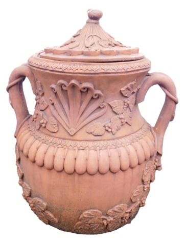 A terracotta garden two handled jar and cover, circular form decorated in relief with grapes, vines, repeat lappet decoration, etc., 54cm high.