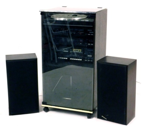 A Sanyo music system, comprising semi automatic turntable TP266, amplifier JA266, stereo tuner JT266L, double cassette deck RD266, contained in a glazed case together with two speakers.