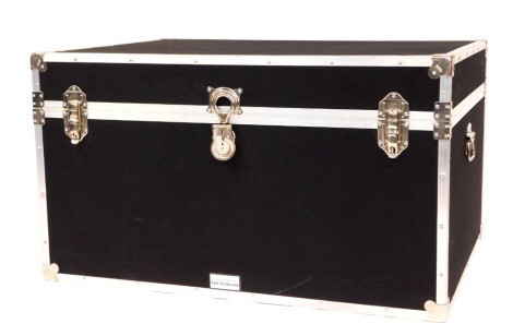 A large cabin type trunk by The Storage Trunk Company, with alloy metal framework and two carrying handles, in black cloth, 58cm high, 102cm wide, 74cm deep.