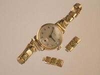 A lady's Accurist yellow metal bracelet watch.