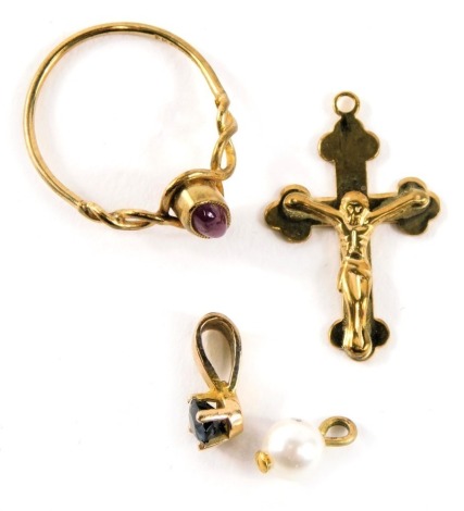 A group of 9ct gold jewellery, comprising a 9ct gold crucifix pendant, a 9ct gold and ruby set dress ring, and two yellow metal pendants, one set with sapphire, one with cultured pearl, unmarked, 2.9g all in. (4)