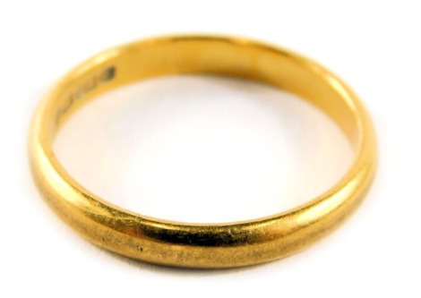 A 22ct gold wedding band, of plain design, thin, maker WW Limited, ring size P½, 3.7g.