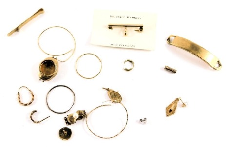 A group of scrap 9ct gold, comprising a 9ct gold identity bracelet bar, single hoop earrings, studs, log charm, bar brooch, tie clip, links, watch case, etc., 28.3g all in, and a cultured pearl set clasp, marked silver.