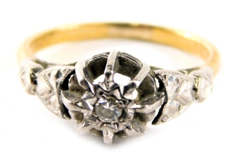 A diamond solitaire dress ring, with tiny diamond in star setting, with arched claws and Art Deco style shoulders, set in white gold on a yellow gold band, ring size L½, marked 18ct plat, 3g all in.