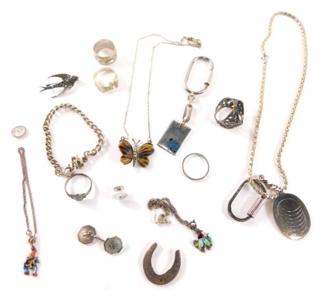 A group of silver and other jewellery, comprising dress ring, marcasite set swift brooch, enamel ladybird keyring, mother of pearl 9ct white gold backed cufflink and associated collar stud, neck chain, oval keyring, etc., 88.2g all in. (a quantity)