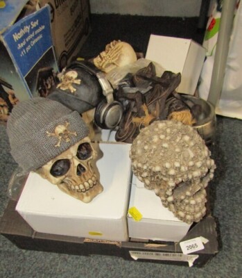 A group of skull ornaments, tribal motorbike riders, coffin, jugs, clothing, etc. (4 boxes and 1 bag)