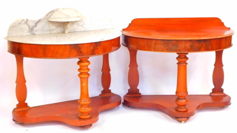 A pair of Victorian figured mahogany Duchess tables, of demi lune design, the washstand with marble top and splash back with shelf and with plain friezes, raised on turned front support and rear legs, on a pot shelf base with bun feet, 107cm wide, 52cm de