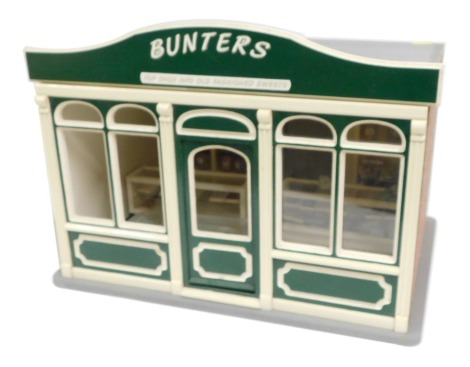 A model of Bunters Top Chocs and Old Fashion Sweets shop, 1:12 scale, with cabinets, furniture and other accessories.