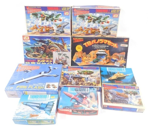 Imai, Bandai and other Thunderbirds model kits, including Thunderbirds excavator, Thunderbird 3, Thunderbird 1, Thunderbird 2 with Thunderbird 4 recovery vehicle and mole models in pod, Thunderbirds Secret Base, and Thunderbirds Rescue Panorama set, etc.