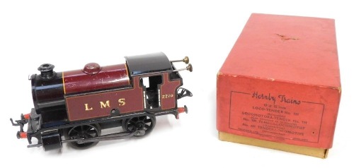 A Hornby O gauge tinplate clockwork 101 tank locomotive (reversing), 0-4-0, LMS red livery, with original box.